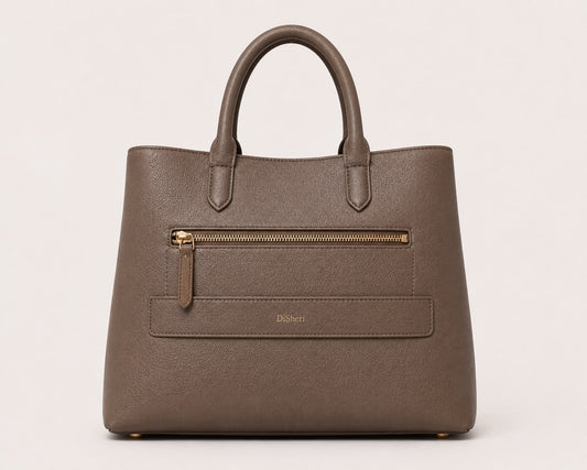DiSheri taupe leather tote, back view with embossed DiSheri wordmark and zip pocket