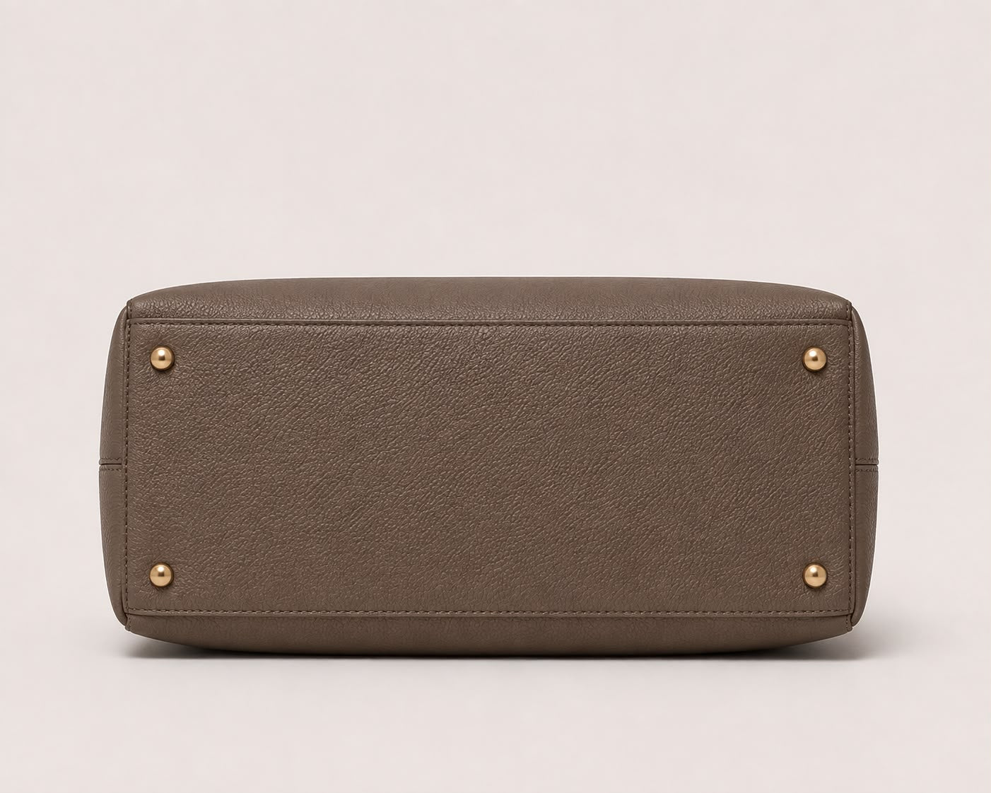 DiSheri taupe leather tote, base with protective feet