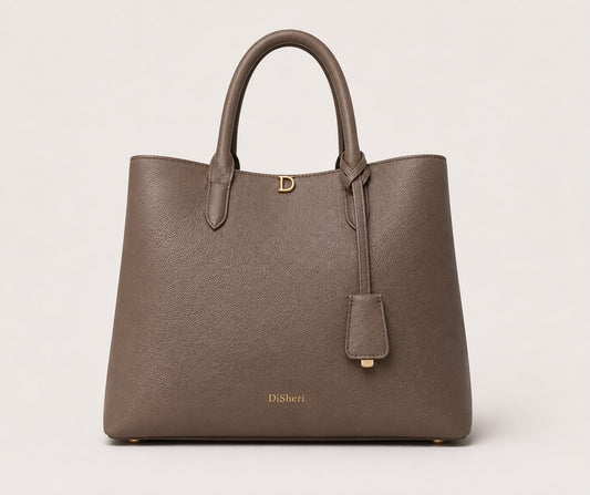 DiSheri taupe leather tote, front view with signature gold D clasp